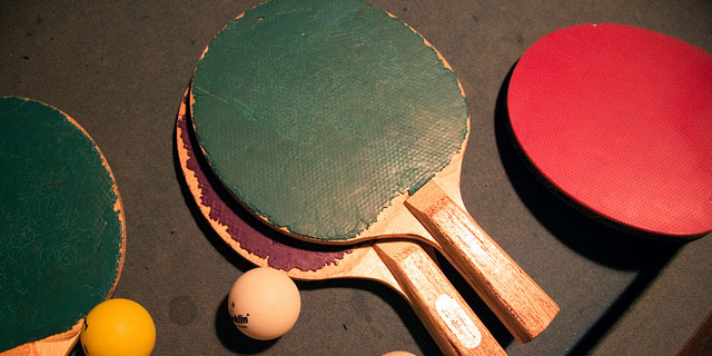 table tennis racket with ping pong balls